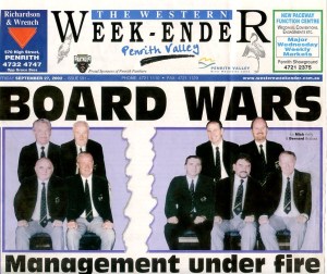 Front page of 'The Western Week-Ender' newspaper featuring the headline 'BOARD WARS' with the subheading 'Management under fire', accompanied by a group photo of eight men in formal attire.